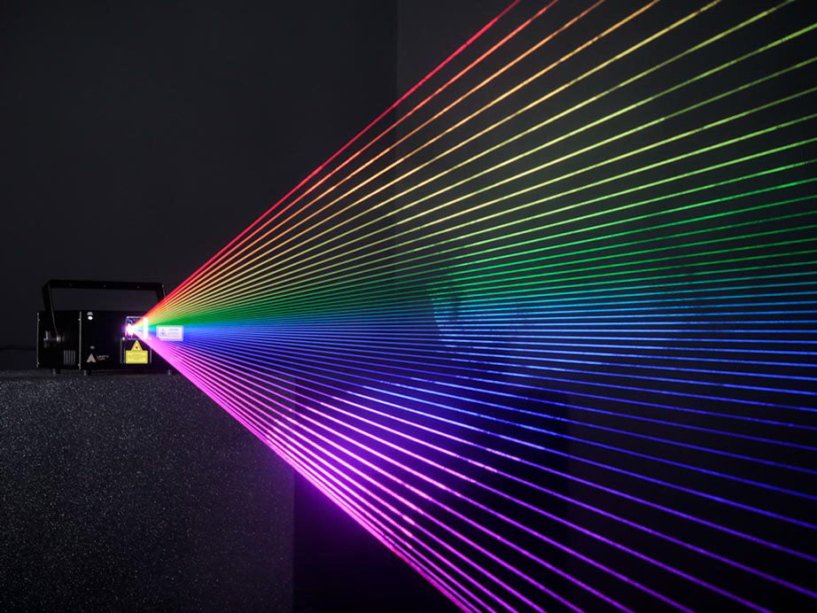 Wave of rainbow colorful laser beams from the Unity Raw 3, a laser created for beginners, DJs, Nightclubs, living rooms, and bedrooms